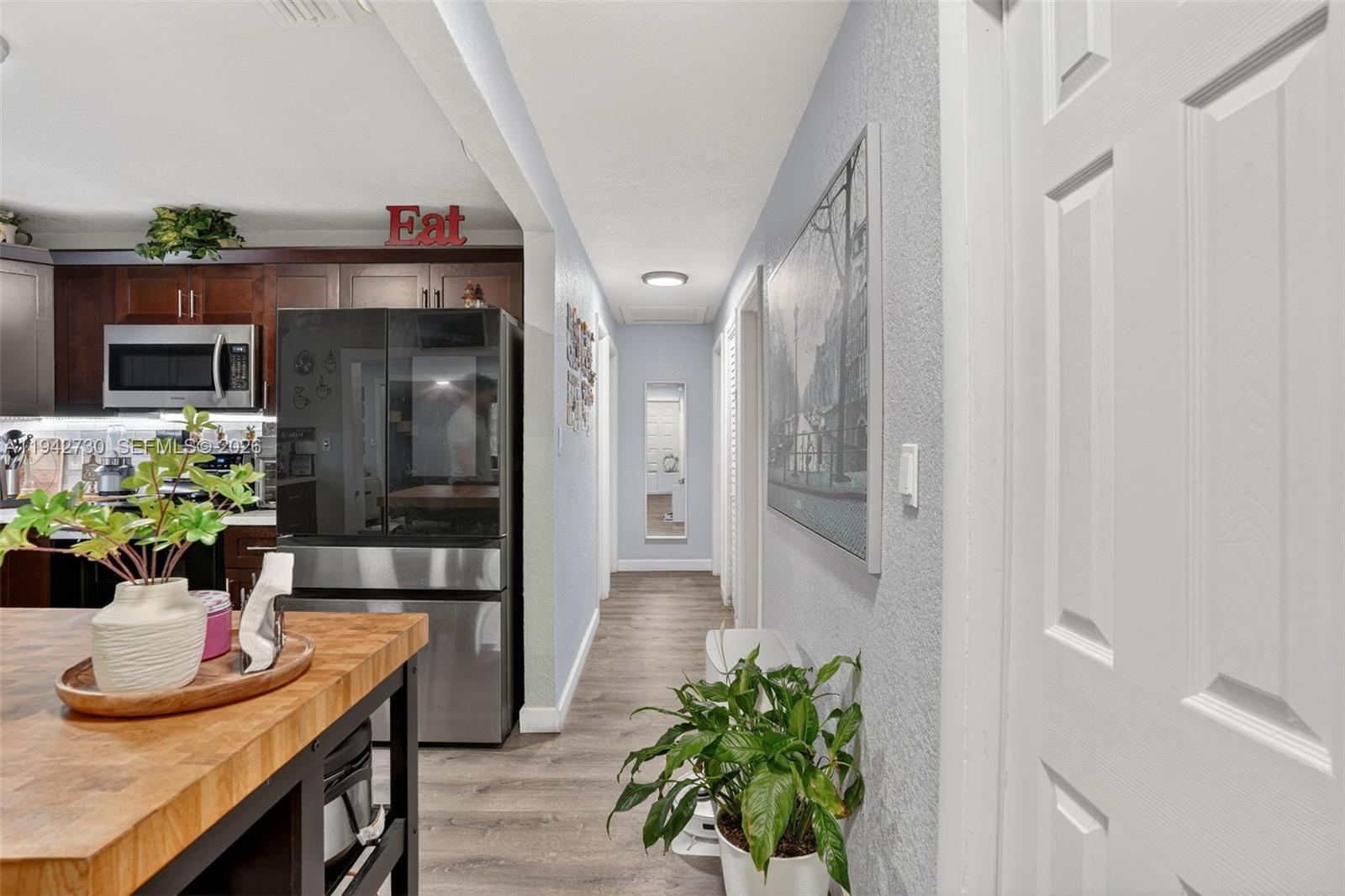 6970 Southwest 24th Street Miramar, FL 33023 - Photo 12 of 39 a dining room with furniture and a potted plant