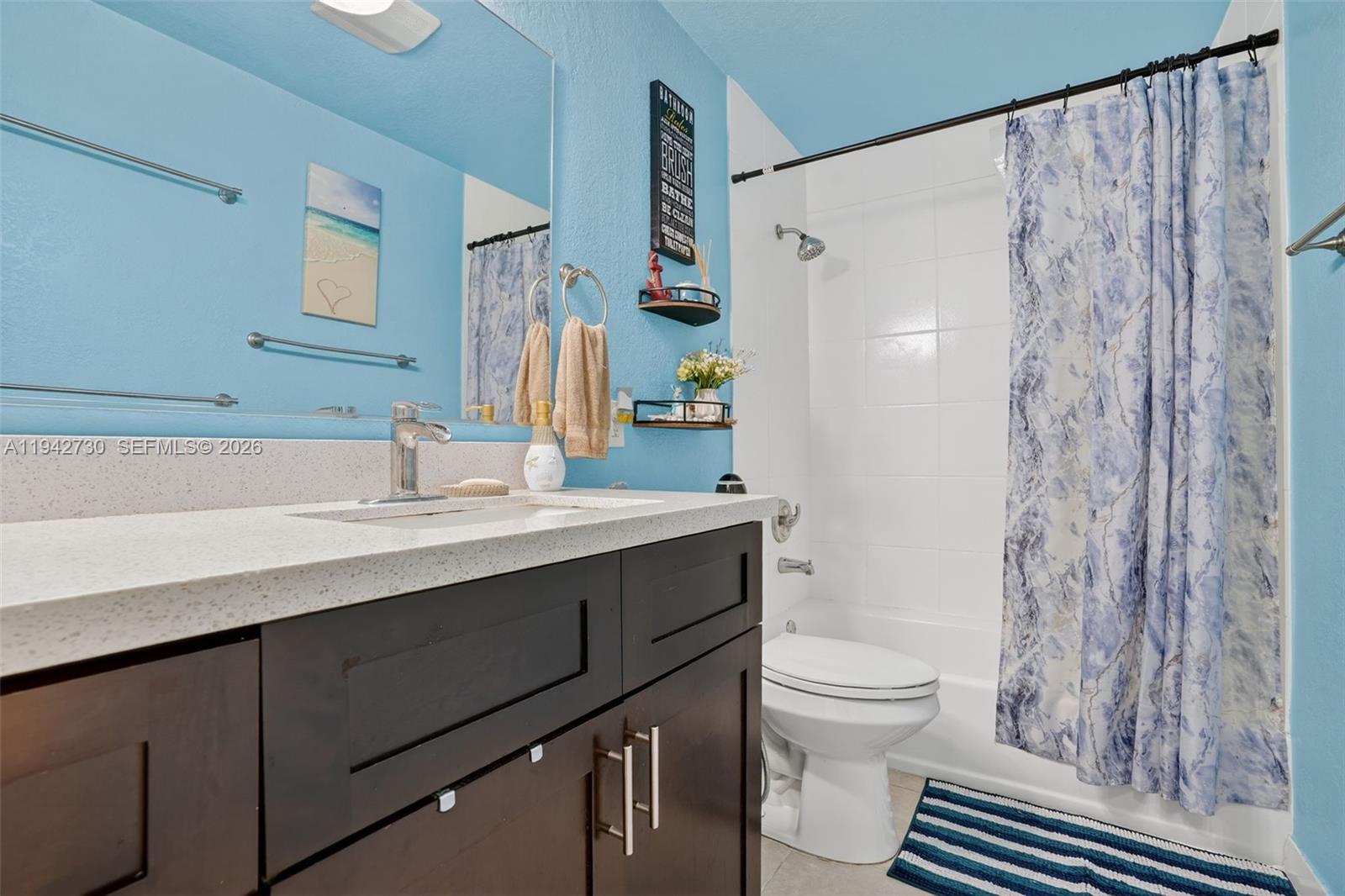 6970 Southwest 24th Street Miramar, FL 33023 - Photo 18 of 39 a bathroom with a sink and a mirror