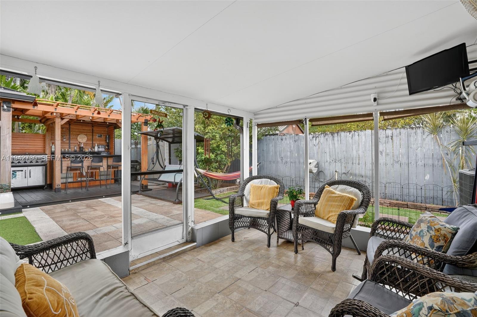 6970 Southwest 24th Street Miramar, FL 33023 - Photo 23 of 39 a view of a livingroom with furniture and workspace
