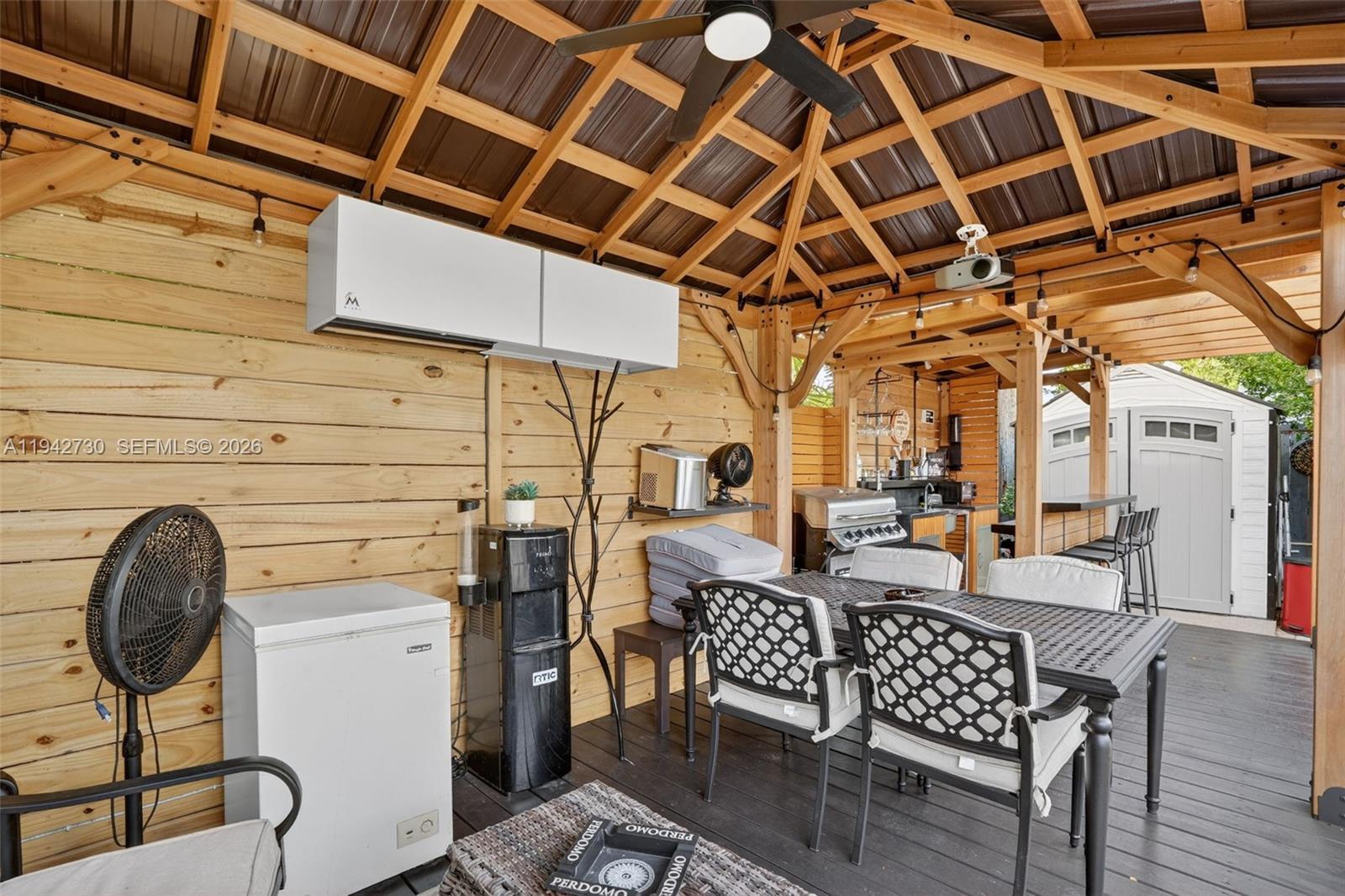 6970 Southwest 24th Street Miramar, FL 33023 - Photo 26 of 39 a outdoor space with patio lots of furniture and white walls