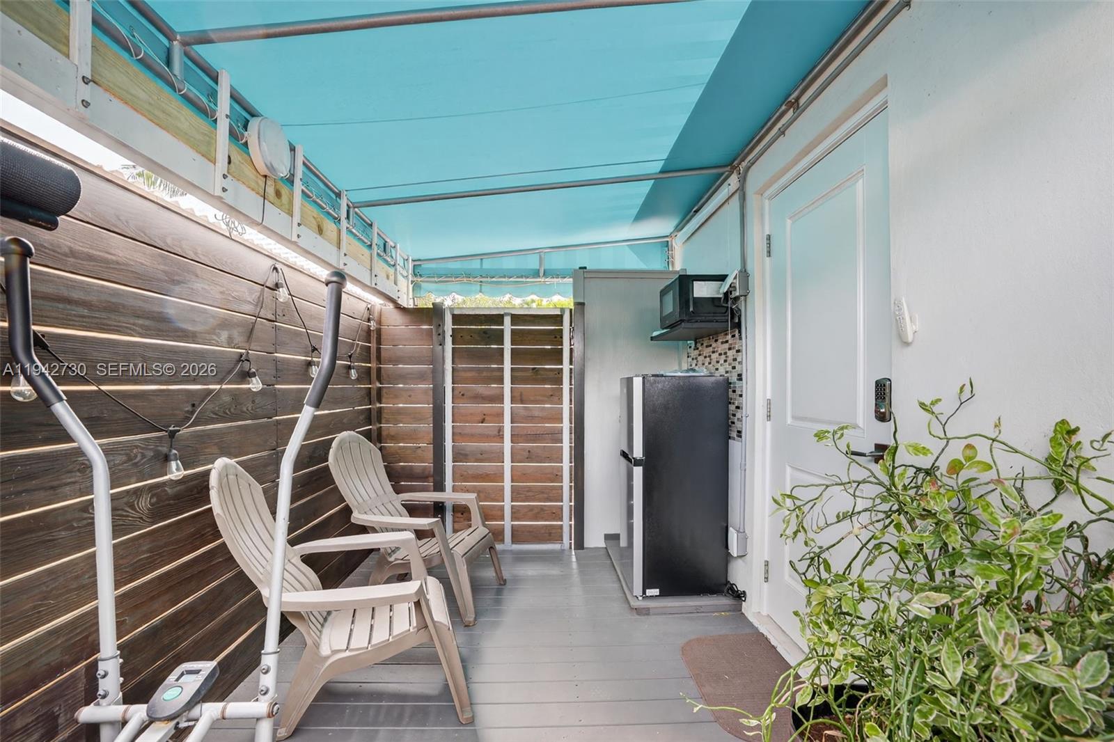 6970 Southwest 24th Street Miramar, FL 33023 - Photo 29 of 39 a view of entryway with outdoor seating