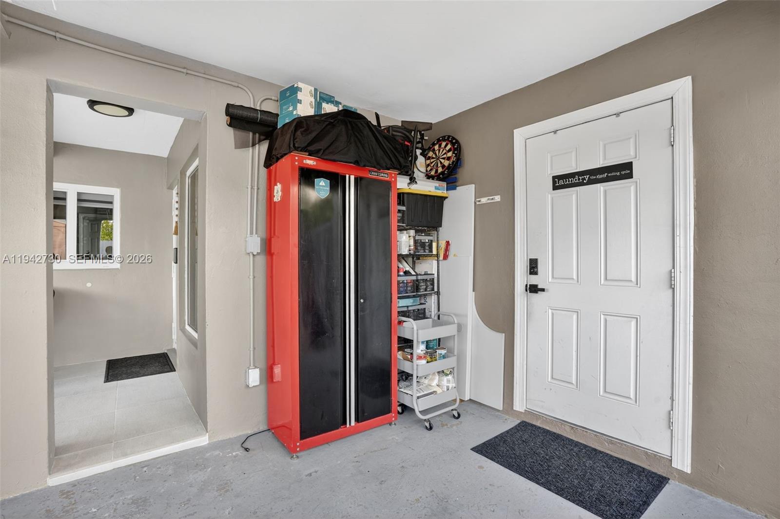6970 Southwest 24th Street Miramar, FL 33023 - Photo 30 of 39 a view of walk in closet with clothes and shoes