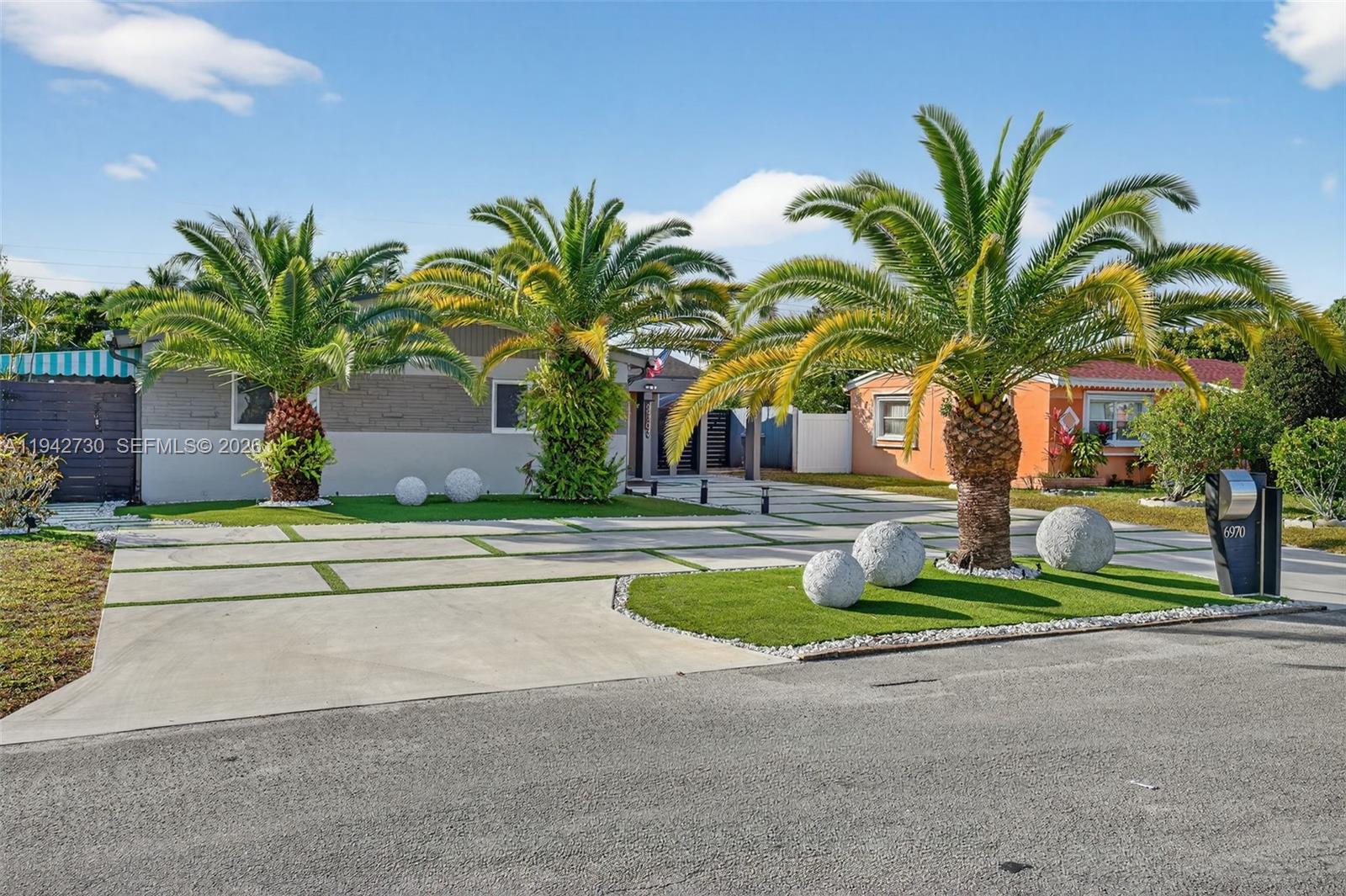 6970 Southwest 24th Street Miramar, FL 33023 - Photo 39 of 39 a palm tree sitting on the side of a building