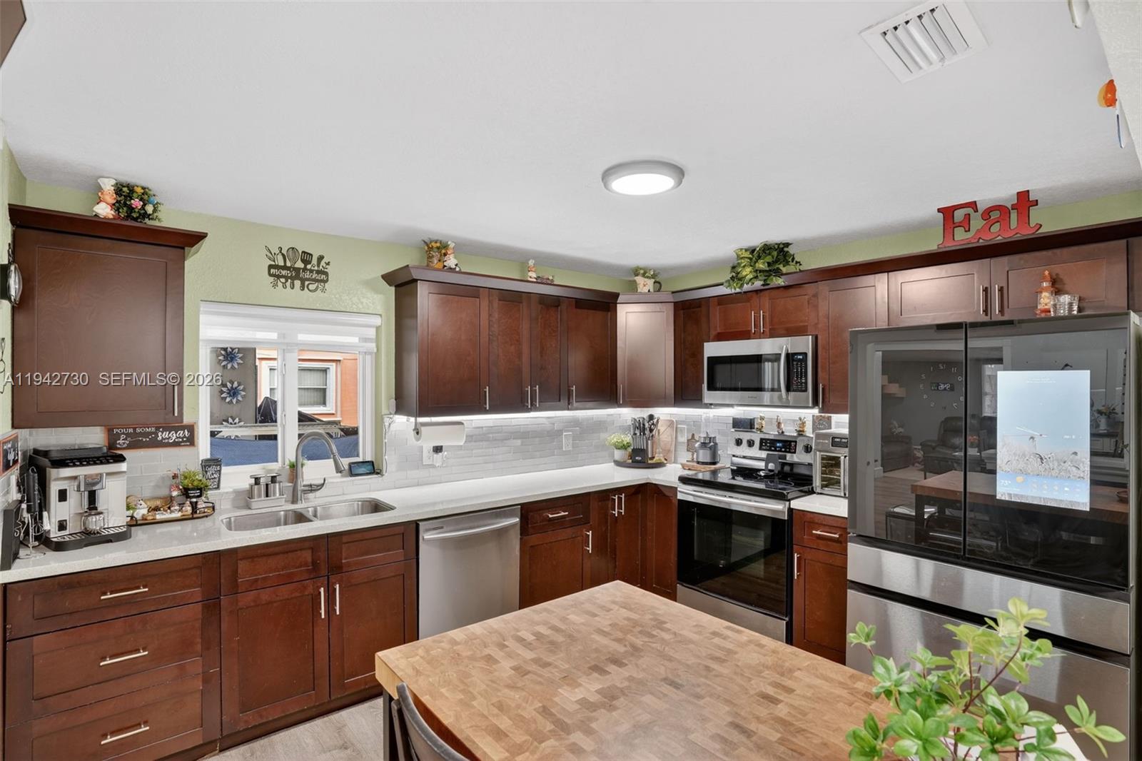 6970 Southwest 24th Street Miramar, FL 33023 - Photo 9 of 39 a large kitchen with lot of counter space and a sink
