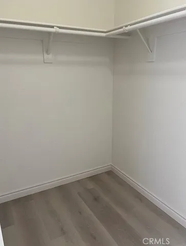 a view of an empty walk in closet