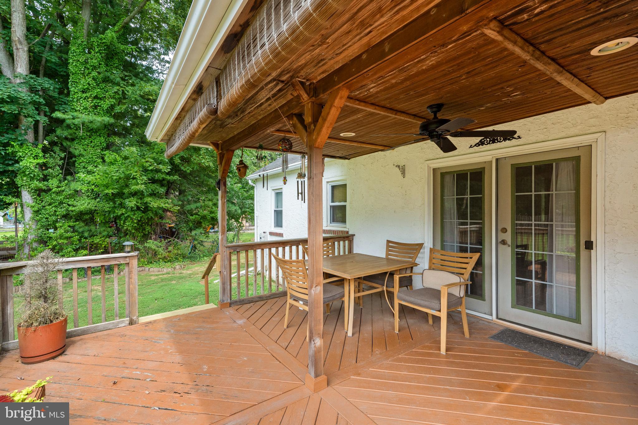 1576 Turk Road Warrington, PA 18976 - Photo 29 of 38 a view of a patio with table and chairs and wooden floor