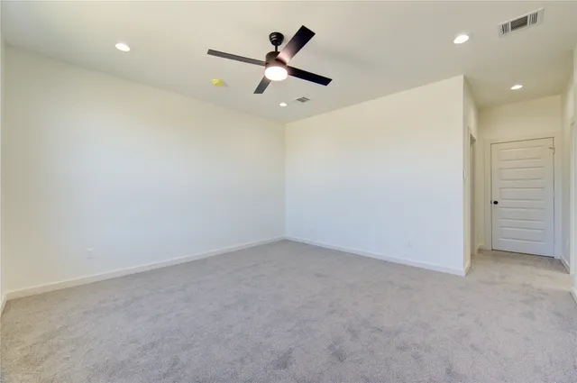 a bathroom with a granite countertop double vanity sink mirror and bathtub