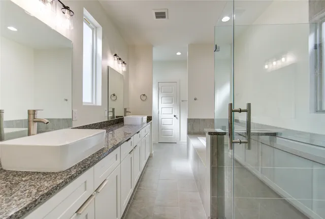 a view of a kitchen with a sink and cabinets