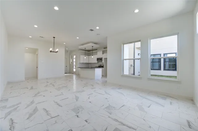 a view of a kitchen with a sink and cabinets