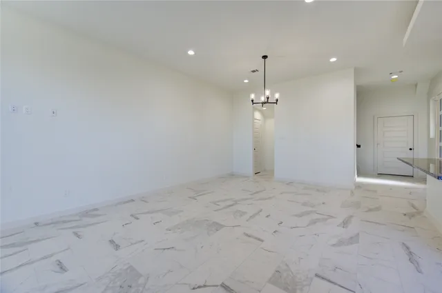 a large kitchen with cabinets and a sink