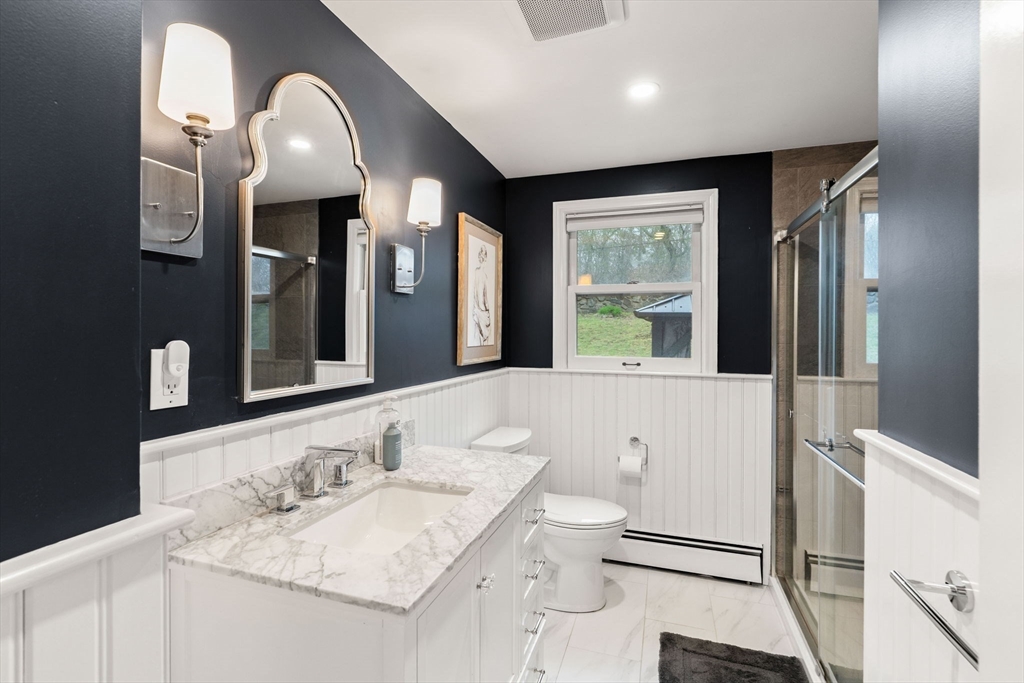 92 Moffatt Road Salem, MA 01970 - Photo 23 of 42 a bathroom with a granite countertop sink mirror and toilet