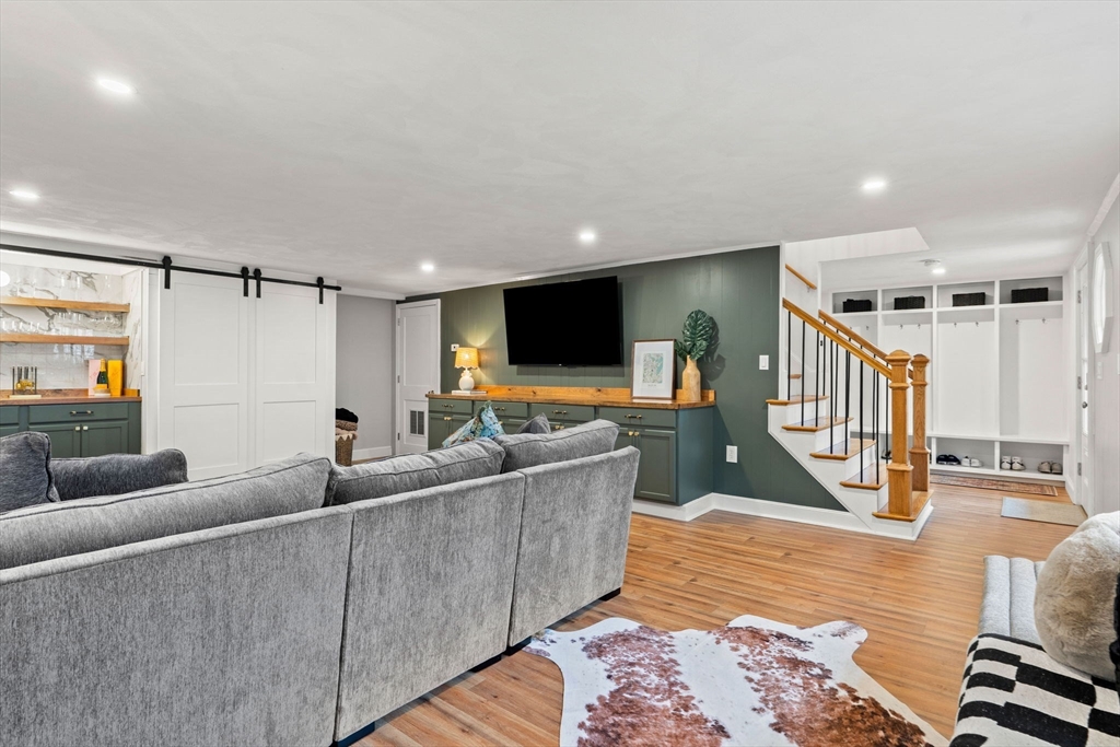 92 Moffatt Road Salem, MA 01970 - Photo 36 of 42 a living room with furniture and a flat screen tv