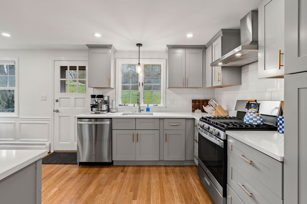 92 Moffatt Road Salem, MA 01970 - Photo 10 of 42 a kitchen with a sink stove and cabinets