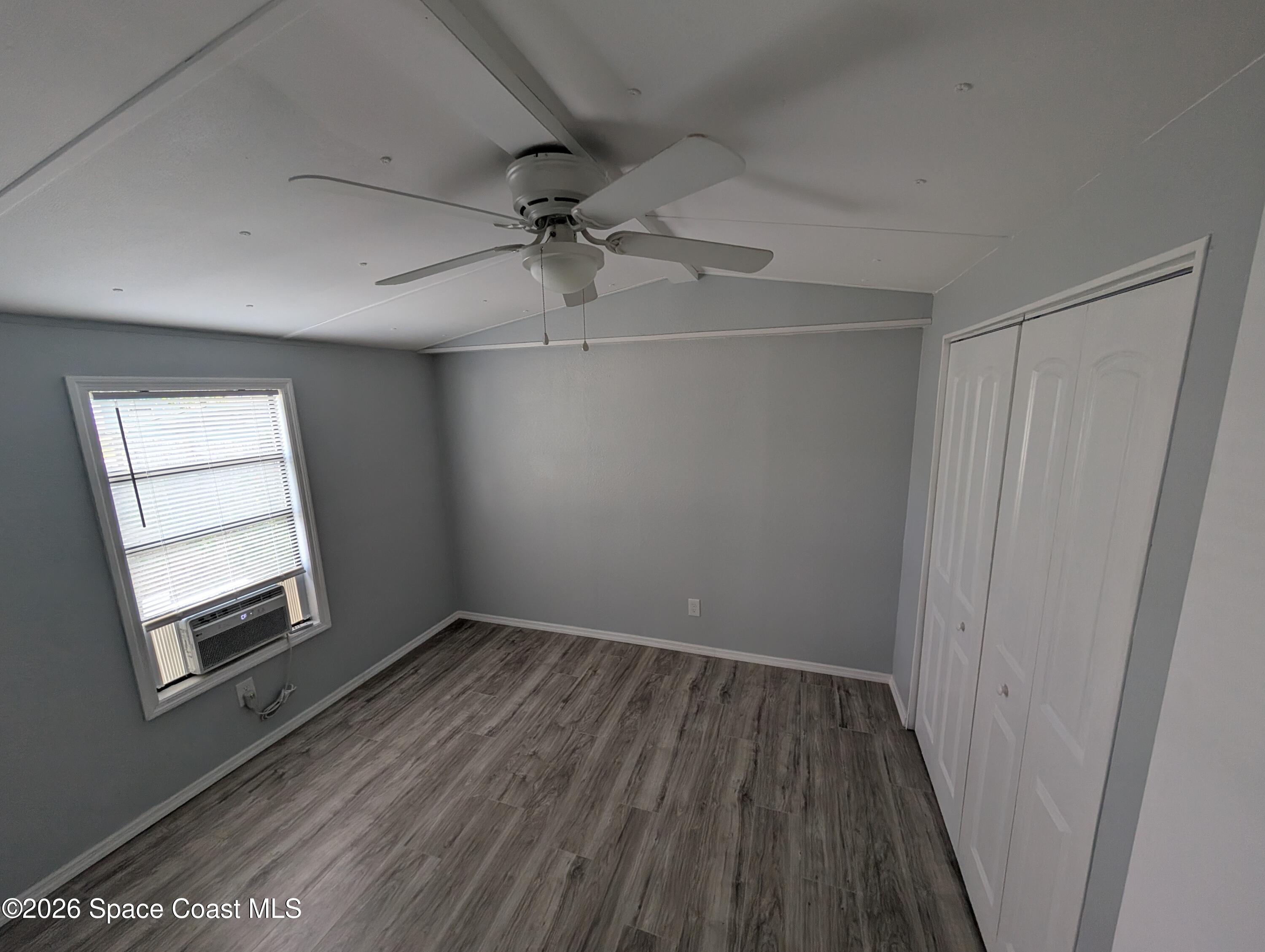 3314 Kittles Street Mims, FL 32754 - Photo 3 of 9 wooden floor in an empty room with a window
