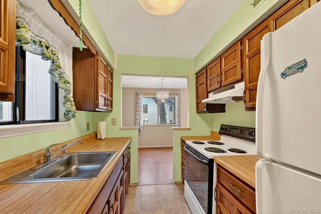 a kitchen that has a sink and a stove
