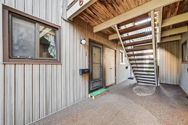 a view of an empty room with windows
