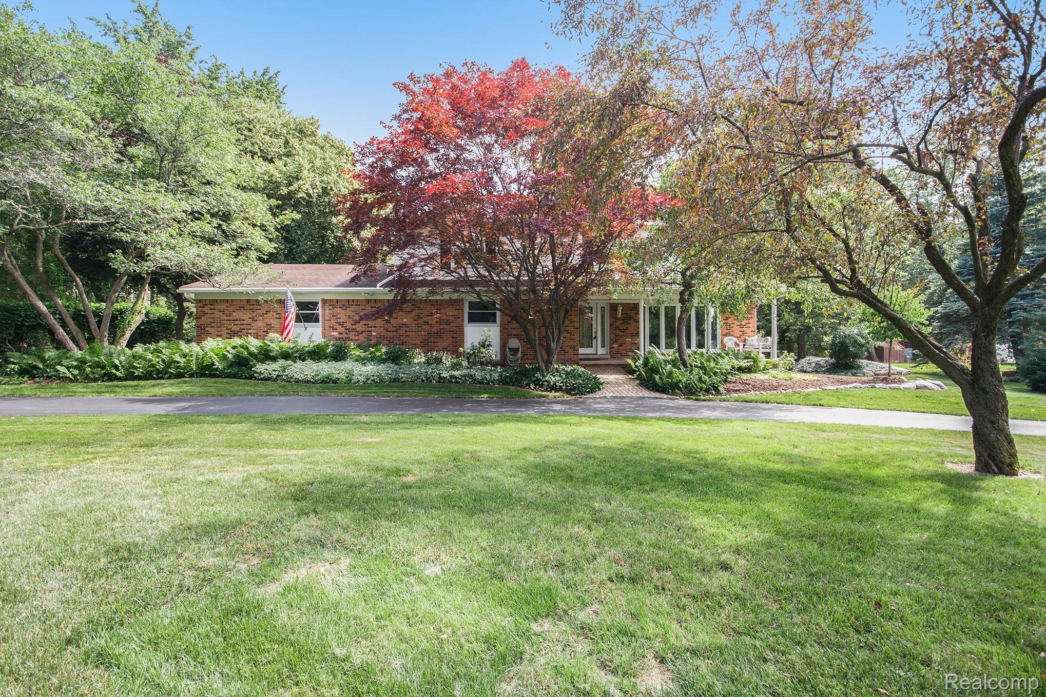 2991 Mohawk Lane Rochester, MI 48306 - Photo 1 of 33 Surrounded by mature trees and a circle driveway