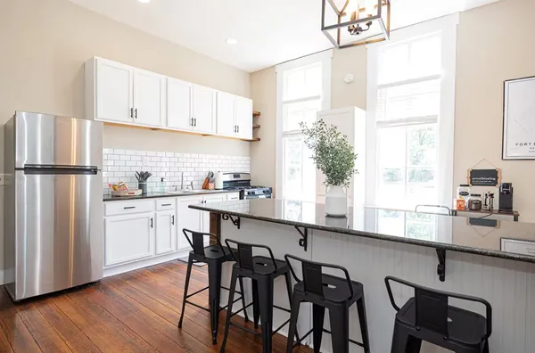 a kitchen with a sink and cabinets