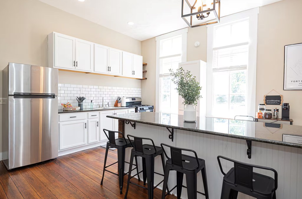 1300 18th Street Columbus, GA 31901 - Photo 11 of 38 a kitchen with appliances cabinets and chair