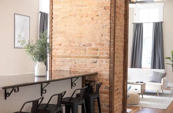 a bathroom with a sink a toilet and a large mirror