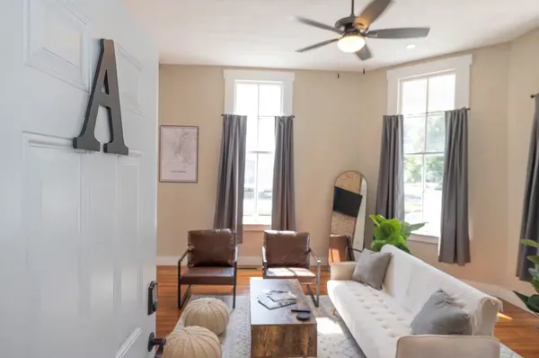 a living room with furniture and a window