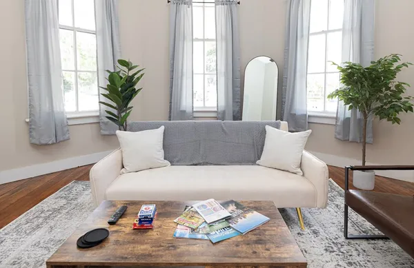 a kitchen with a table chairs stove and cabinets