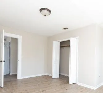 a view of an empty room and window