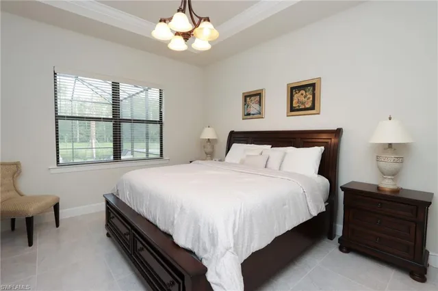 a bedroom with bed and a window