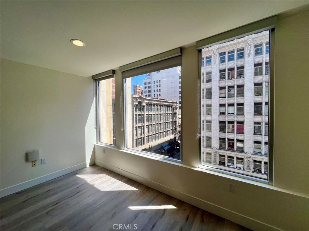314 6th, Unit 506 Los Angeles, CA 90014 - Photo 5 of 12 a view of a living room with a large window