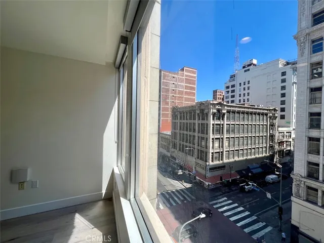 a view of a balcony with wooden floor