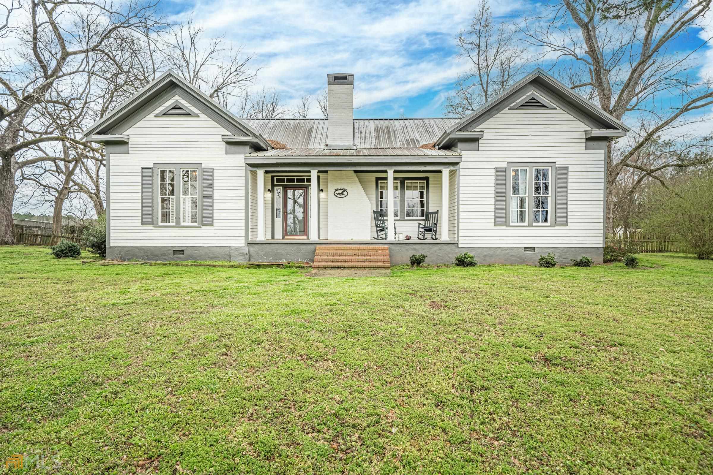 720 Hill Road Forsyth, GA 31029 - Photo 1 of 1 a front view of a house with a yard