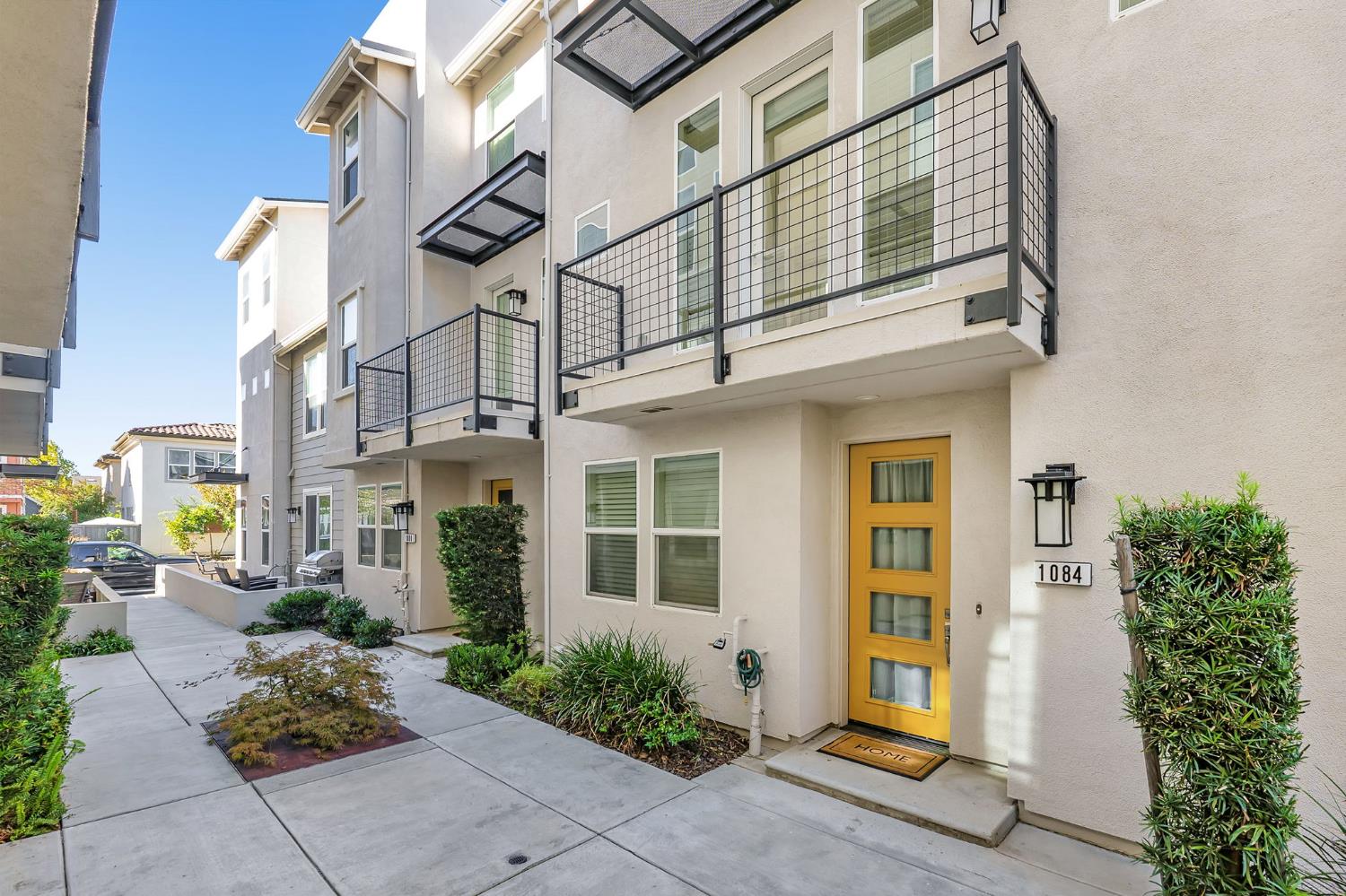 a view of a building with potted plants