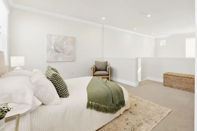 a bedroom with a bed and a couch