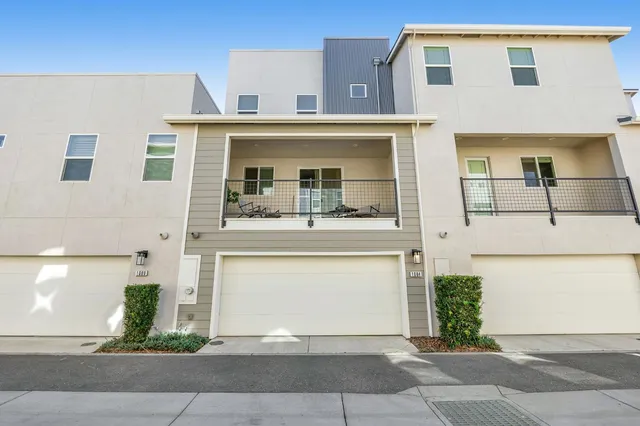 a front view of a house with a garage