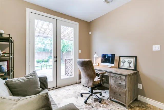 a work room with furniture and a window