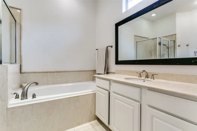a bathroom with a bathtub and a sink