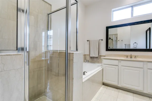 a bathroom with a bathtub and a sink