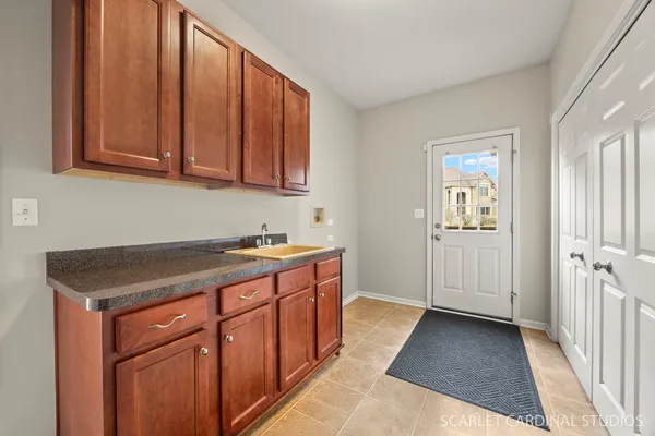 a bathroom with a sink a toilet a mirror and shower curtain
