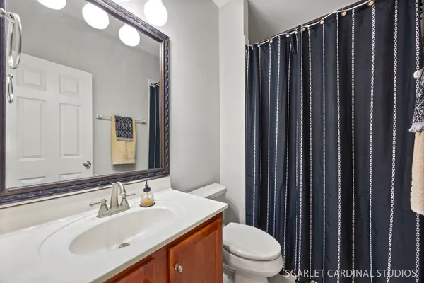 a bedroom with a bed and a tv