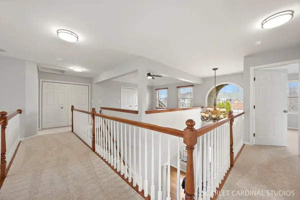 a view of a livingroom with a ceiling fan and window
