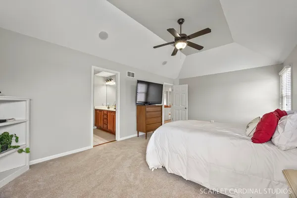 a bathroom with a double vanity sink a mirror and a bathtub