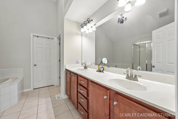 a bathroom with a tub and shower