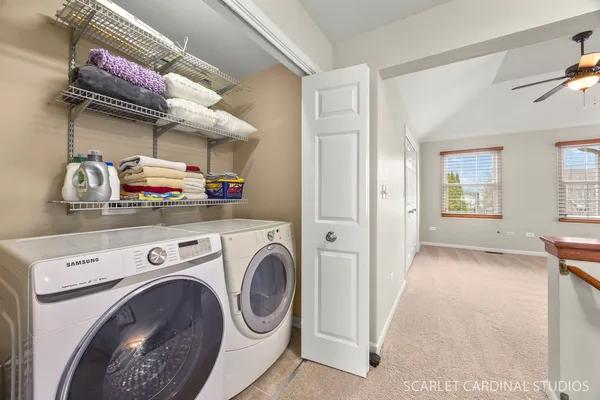 a view of a two chairs in patio of house