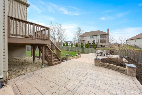 a view of a house with a yard and sitting area