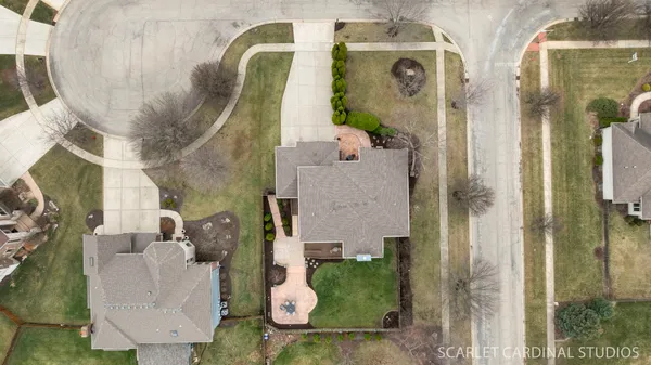 an aerial view of a house with outdoor space
