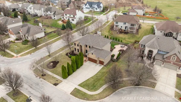 an aerial view of a house with swimming pool