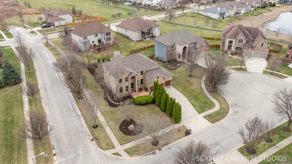an aerial view of residential houses with outdoor space