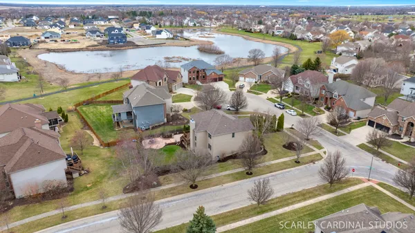 an aerial view of residential houses with outdoor space