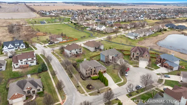 an aerial view of residential houses with outdoor space