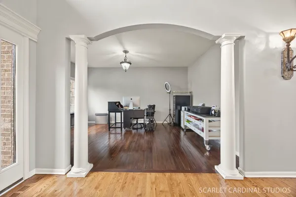 a living room with furniture and wooden floor